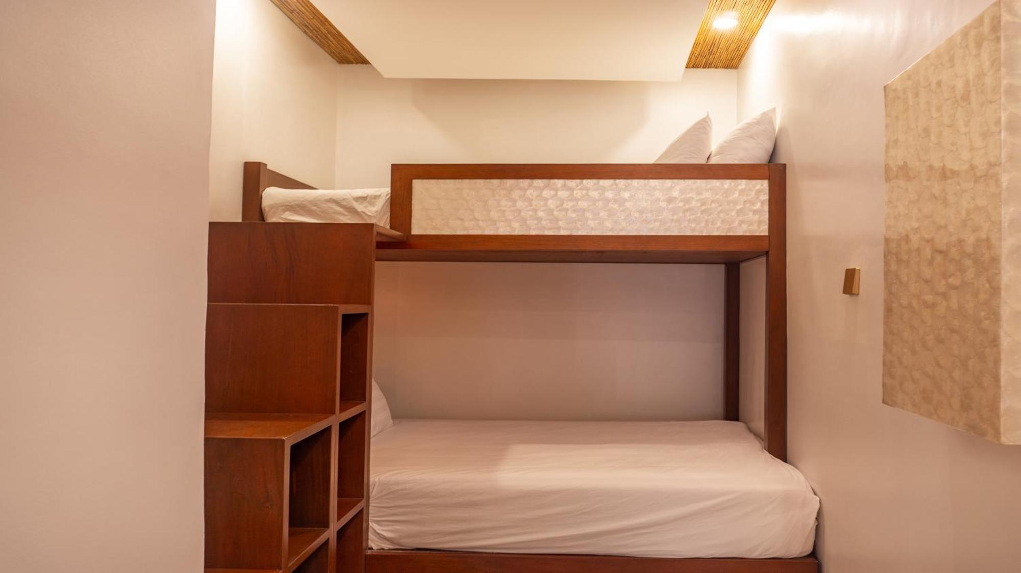 Ambassador In Paradise Balabag  Bagian luar foto A bunk bed